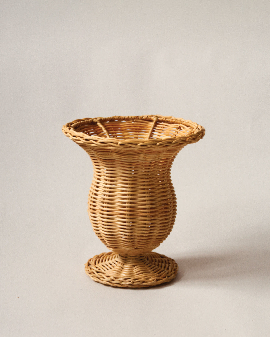 Rattan vase on a stand